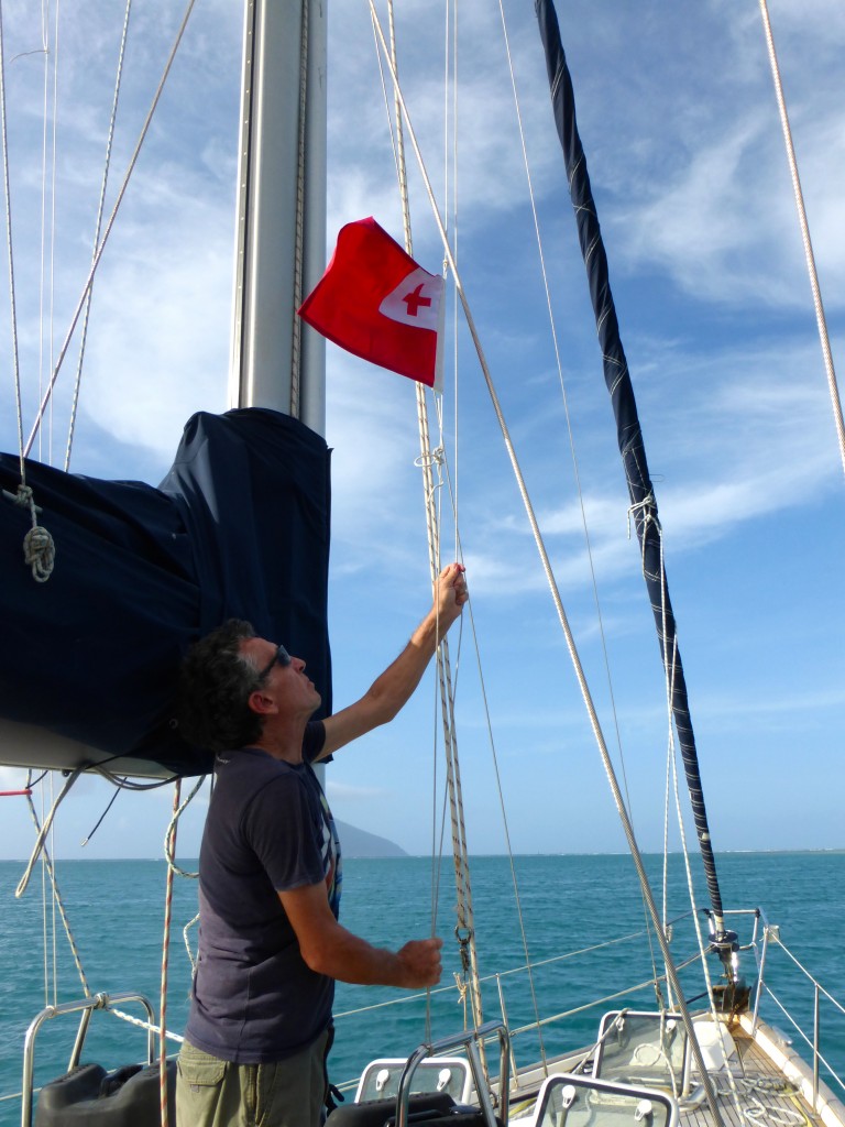 Captain Raising Tongan Courtesy Flag