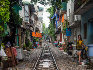 Railroad Through Alley Between Houses in Hanoi