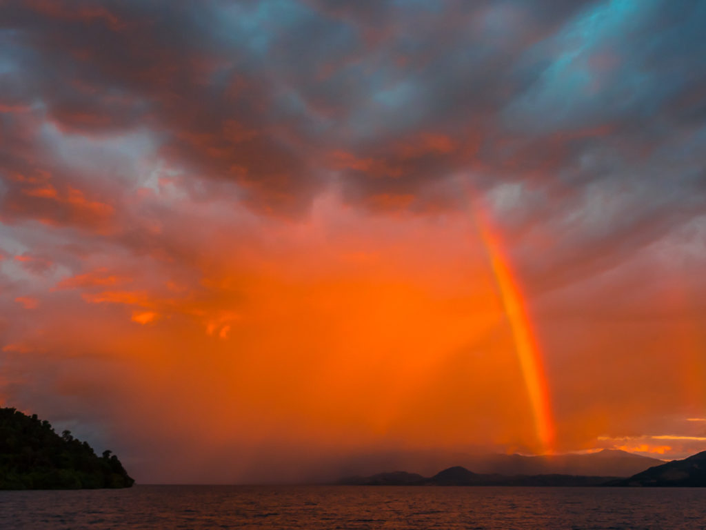 Rainbow Against Orange Sunset In Nosy Momoko