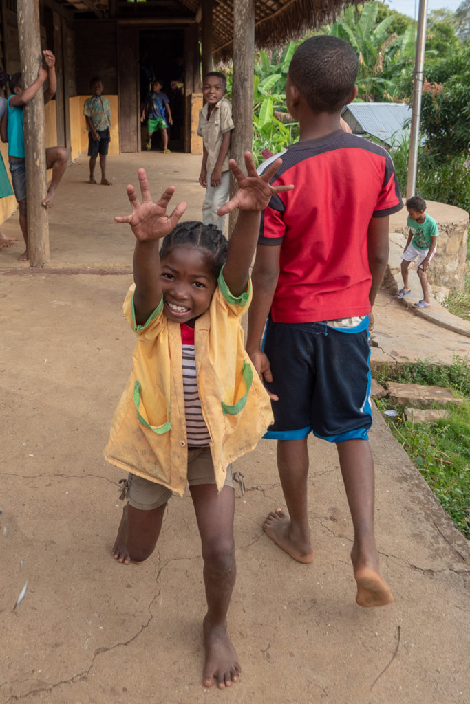 School Girl Jumping With Joy In Nosy Komba