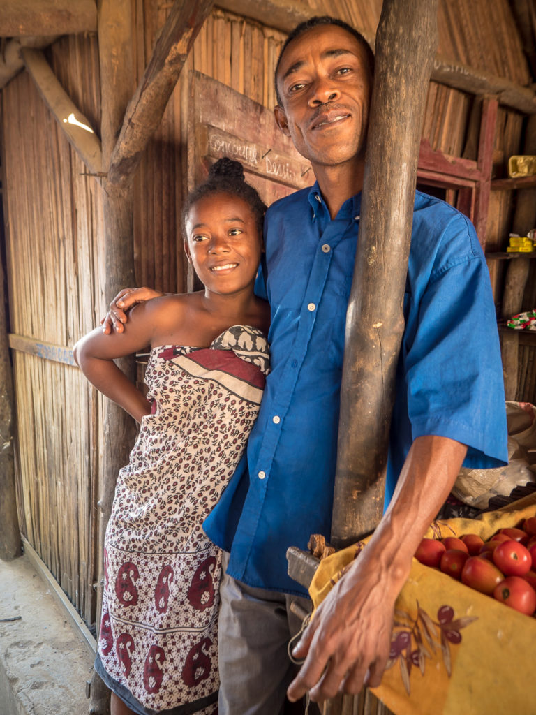 A shopkeeper with his granddaughter Nosy Komba Madagascar