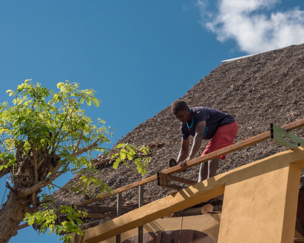 Man building a structure at Antintorona Nosy Komba Madagascar