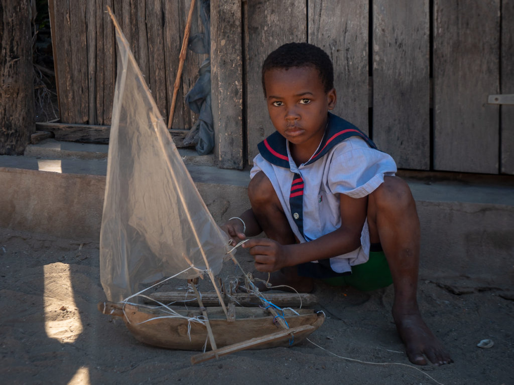 Young Sailor with Toy Boat In Madagacar