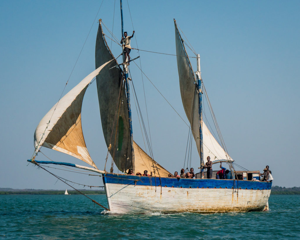 Local Wooden Sailing Boat with Three Sails In Madagascar