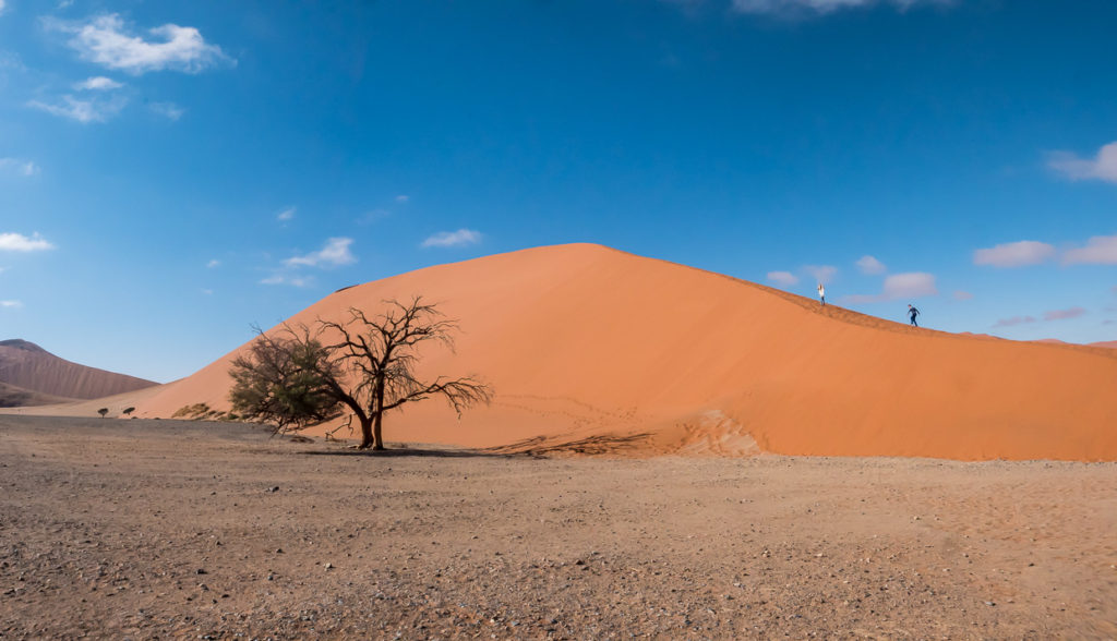 Hikers Asending Deadvlei Sand Dune in Sossusvlei Namibia