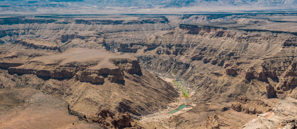 Fish River Canyon Panorama with blue and green water in basis