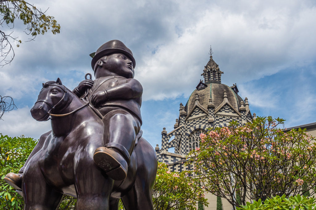 Botero Statue With Basilica of Our Lady of Candelaria In Background