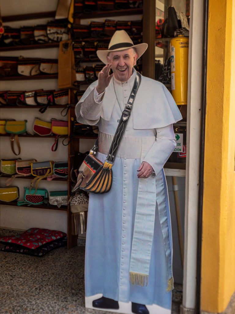 Cardboard cutout of Pope Francisco donning Tipico Carriel Bag in Jericó, Colombia