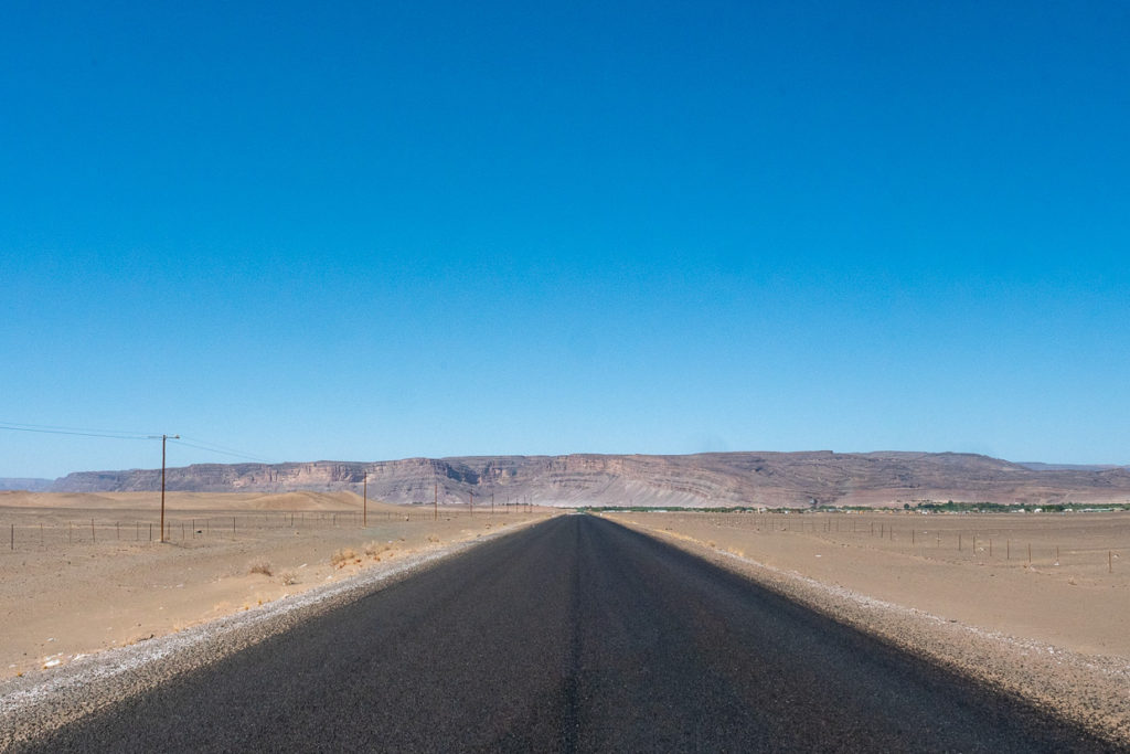 Paved road ending in the mountains in Namibia